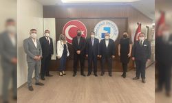 MHP'den Rektör Kutluhan'a Nezaket Ziyareti