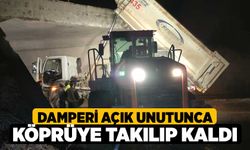 Damperi açık unutunca köprüye takılıp kaldı