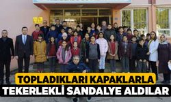 Topladıkları kapaklarla tekerlekli sandalye aldılar