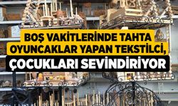 Boş vakitlerinde tahta oyuncaklar yapan tekstilci, çocukları sevindiriyor