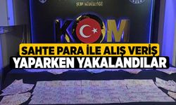 Sahte para ile alış veriş yaparken yakalandılar