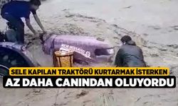 Sele kapılan traktörü kurtarmak isterken az daha canından oluyordu