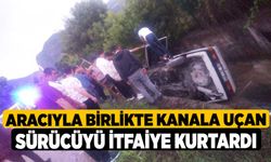 Aracıyla birlikte kanala uçan sürücüyü itfaiye kurtardı