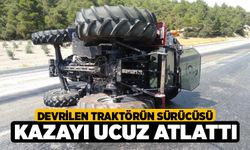 Devrilen traktörün sürücüsü kazayı ucuz atlattı