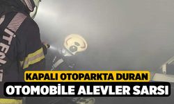 Kapalı otoparkta duran otomobile alevler sarsı