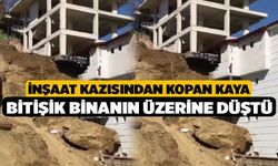 İnşaat kazısından kopan kaya bitişik binanın üzerine düştü