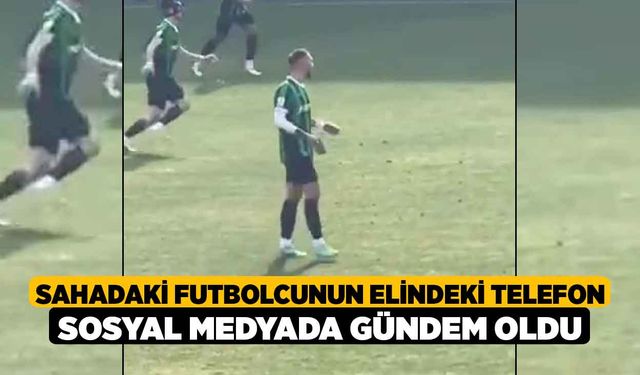 Sahadaki futbolcunun elindeki telefon sosyal medyada gündem oldu