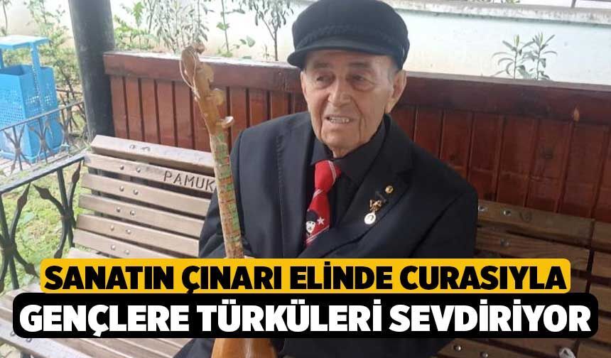 Sanatın çınarı elinde curasıyla gençlere türküleri sevdiriyor